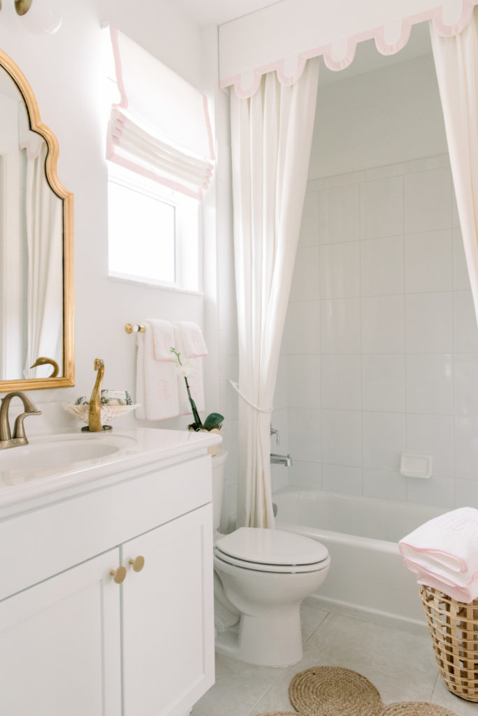 pink white and gold bathroom